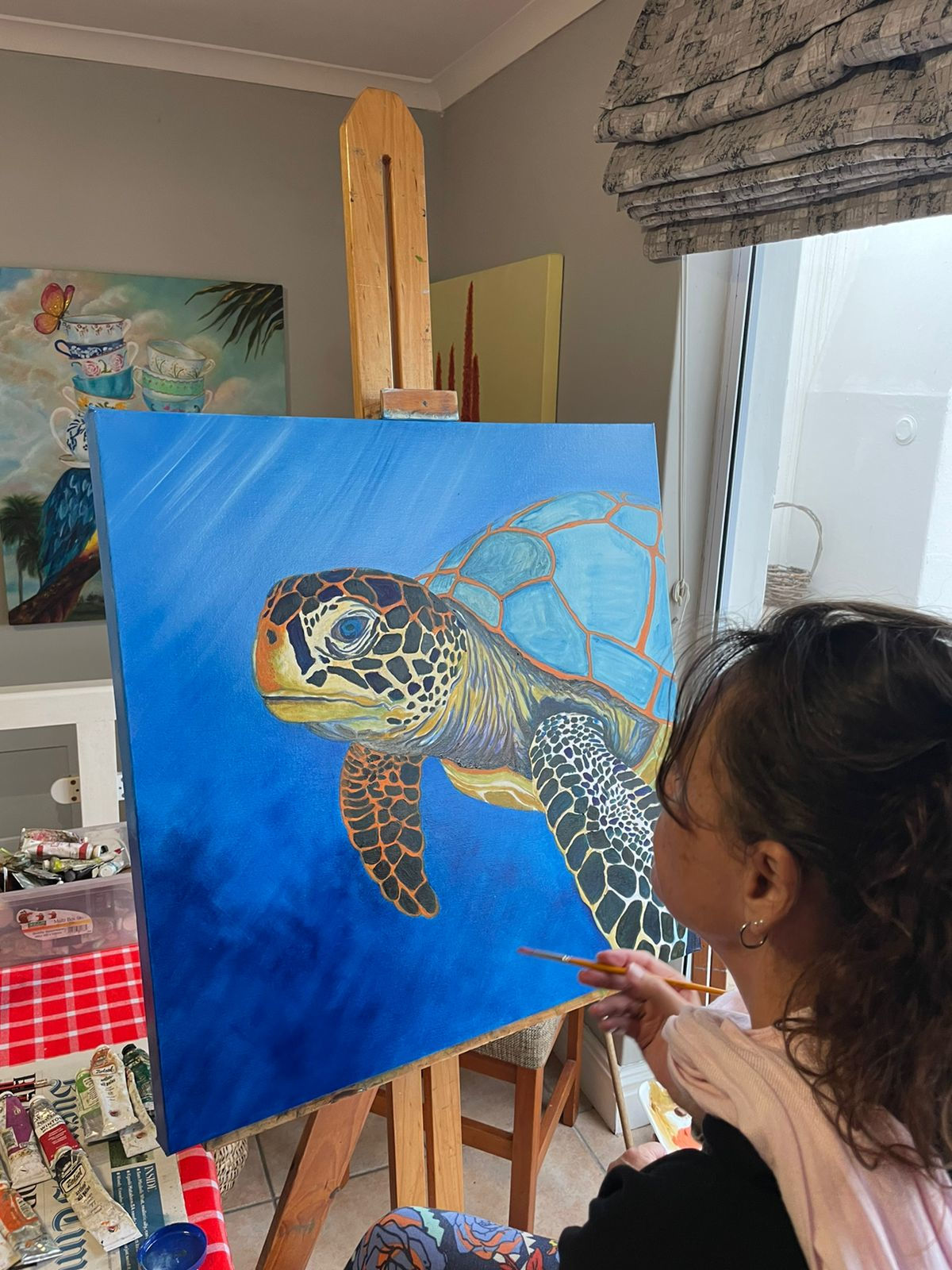 Artist painting new painting